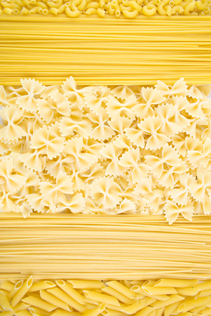 Various types of pasta. background of different dry macaroni. Italian cuisine concept, food ingredients. Flat lay. Top view, copy space.の写真素材