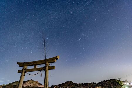 Starry sky and torii in the sky seen in Kujukuri-cho, Chiba Prefecture