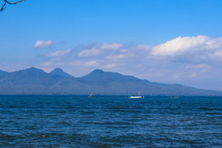 beautiful view of Cacalan Banyuwangi beach with mountains in the backgroundの写真素材
