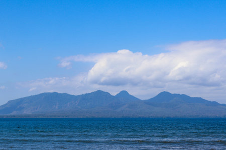 beautiful view of Cacalan Banyuwangi beach with mountains in the backgroundの写真素材