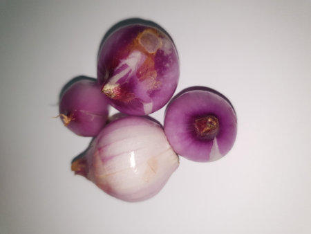 Red Onions (Bawang Merah) or shallots on a white background.の写真素材