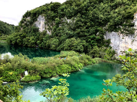 The Blue Plitvice Lakes in Croatia are an amazing piece of nature surrounded by bright green vegetation. View from above.の写真素材