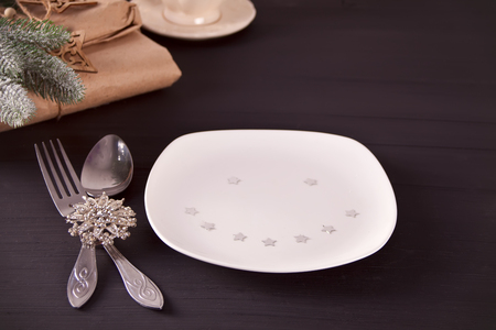 Christmas table setting with christmas decorations with funny smiling plate. Christmas background.の写真素材