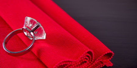 Big diamond ring on the red table napkin.の写真素材