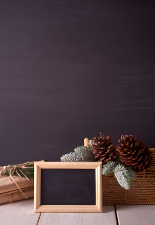 Christmas decorations with blackboard on the black background with copy spaceの写真素材