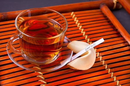 Cup of hot tea on a wooden backgroundの写真素材