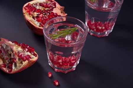 Pomegranate water on the tray, cold refreshing and detox drinkの写真素材
