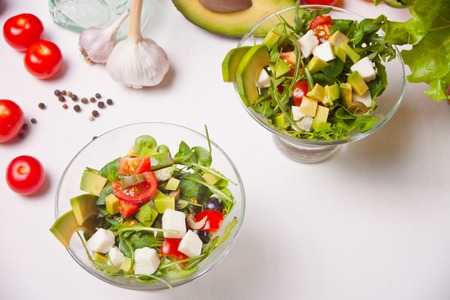 Fresh mixed vegetables salad on a bowls on the white background.の写真素材