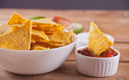 Nachos with salsa dip on the wooden tableの写真素材