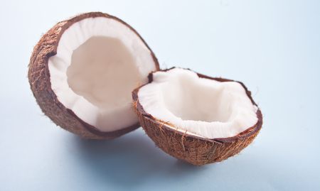 Exotic tropical coconut on blue table