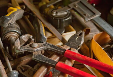 Collection of vintage carpentry tools on an old workbench: woodworking, craftsmanship and handwork concept, flat layの写真素材