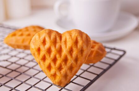 Heart shaped cookies on the baking rackの写真素材
