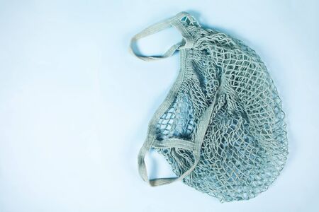 Eco friendly mesh string cotton shopping bag. No plastic. Ecological concept. Zero waste. Top view....