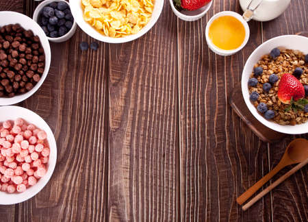 Healthy breakfast. Granola, muesli with fresh berries and other flakes and corn balls.