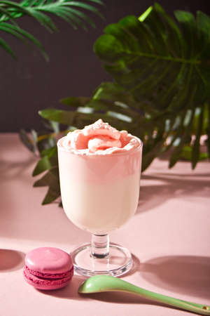 Glass of rose or strawberry iced Dalgona whipped drink coffeeの写真素材