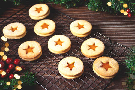 Traditional Austrian Christmas cookies Linzer biscuits filled with apricot jam