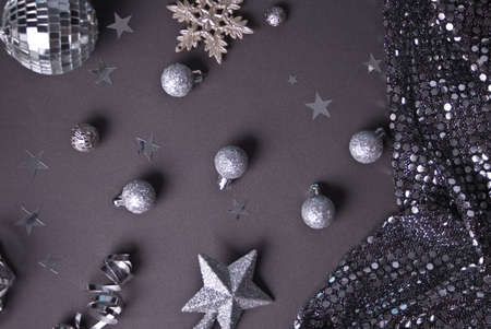 Christmas decoration with silver toys, stars, balls on gray background. Top viewの写真素材