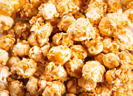 Caramel popcorn snack background texture. Close up. Top view.の写真素材