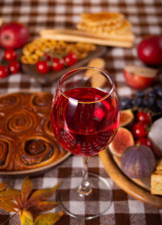 Glass of red wine and snacks. Autumn dinner for celebration Thanksgiving Day. holiday party. Festive table.の写真素材