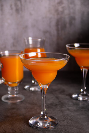 Pumpkin fall seasonal drink cocktail latte with spices and whipped cream for Thanksgiving or Halloween party festive celebrate.の写真素材