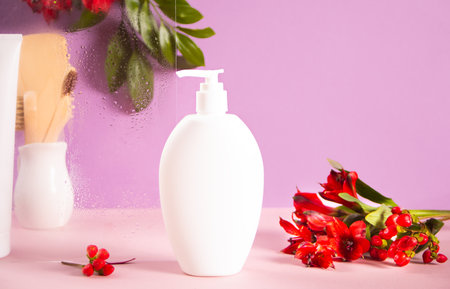 Blank mock up bottle beauty cosmetic skin care organic product for bathing routine with flowers on violet background. Place your design.の写真素材