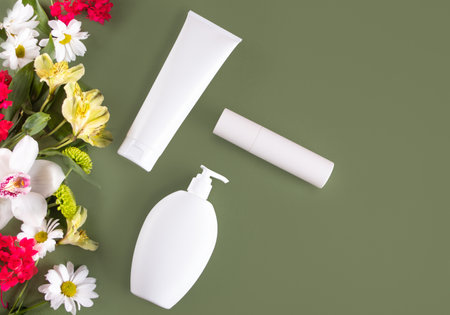 Blank mock up bottles beauty cosmetic skin care organic product for bathing routine with plant branches and flowers. Place your design.の写真素材