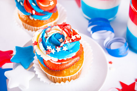 Independence Day Fourth of July USA American patriotic party with american symbols. Cupcakes dessert decorated cream cheese or buttercream.の写真素材
