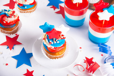 Independence Day Fourth of July USA American patriotic party with american symbols. Cupcakes dessert decorated cream cheese or buttercream.の写真素材