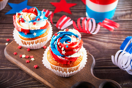 Independence Day Fourth of July USA American patriotic party with american symbols. Cupcakes dessert decorated cream cheese or buttercream.の写真素材