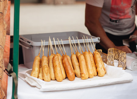 Selling deep fried corn dog. street food conceptの写真素材