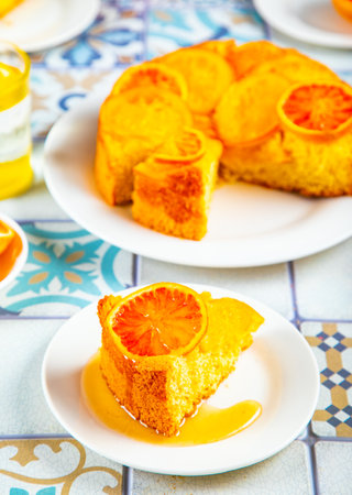 Orange cake with fruit citrus slices on the plateの写真素材