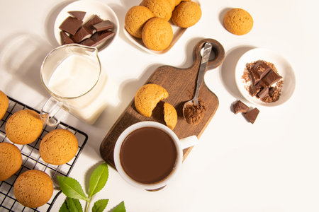 Hot chocolate or coffee espresso with chocolate pieces and cookies. Top view.の写真素材