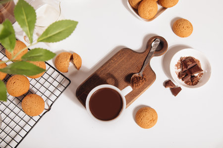 Hot chocolate or coffee espresso with chocolate pieces and cookies. Top view.の写真素材
