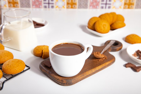 Hot chocolate or coffee espresso with chocolate pieces and cookiesの写真素材
