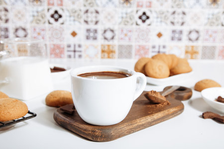 Hot chocolate or coffee espresso with chocolate pieces and cookiesの写真素材