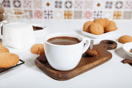 Hot chocolate or coffee espresso with chocolate pieces and cookiesの写真素材