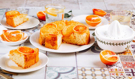 Orange cake with fruit citrus slices on the plateの写真素材
