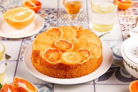 Orange cake with fruit citrus slices on the plateの写真素材