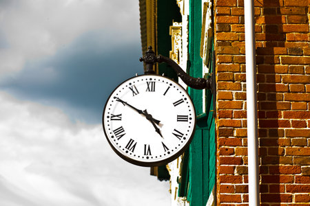 Clock on the old house.の写真素材