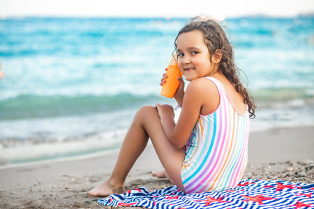 Cute little girl at the beach in summer. Holiday vacation with childrenの写真素材