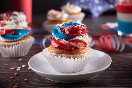 Independence Day Fourth of July USA American patriotic party with american symbols. Cupcakes dessert decorated cream cheese or buttercream.の写真素材