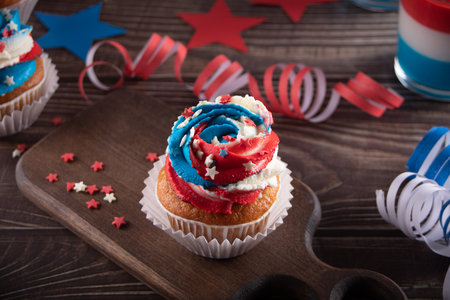 Independence Day Fourth of July USA American patriotic party with american symbols. Cupcakes dessert decorated cream cheese or buttercream.の写真素材