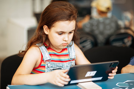 School kids in class using a digital tabletの写真素材