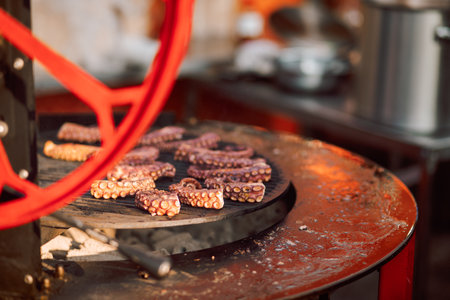 Chef fries octopus tentacles. Seafood. Mediterranean cuisine delicacy