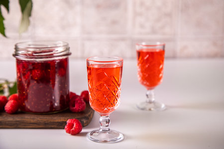 Raspberry alcohol liqueur drink on the table.