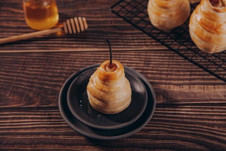 Pears in puff pastry dough drizzled with honey. Healthy and organic food.の写真素材