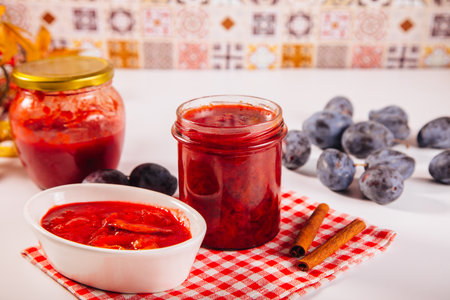Homemade plum jam and fresh organic plums