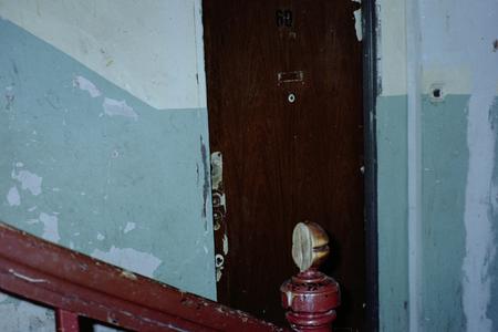 A broken staircase. Derelict door.の写真素材