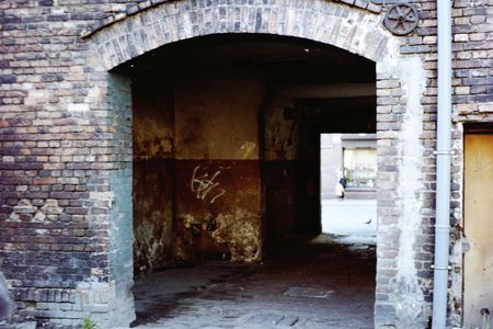 A dirty gate in polish slums.の写真素材