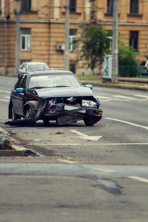 Car crash accident on city street, damaged automobile after collision in the cityの写真素材